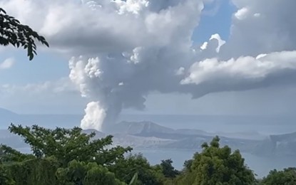 <p><strong>HEIGHTENED ALERT.</strong> Taal Volcano emits smoke in a screenshot of a video taken by the Philippine Coast Guard on Saturday morning (March 26, 2022). The Philippine Institute of Volcanology and Seismology raised the status of the volcano from Alert Level 2 (increasing unrest) to Alert Level 3 (magmatic unrest) due to magmatic intrusion at the main crater that may result in succeeding eruptions. <em>(Screengrab from PCG)</em></p>