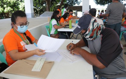 Over 300 farmers in Batac City get indemnity checks from PCIC