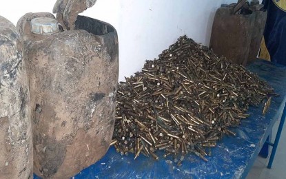 <p><strong>SEIZED AMMOS.</strong> Police personnel seize around 12,013 pieces of ammunition on March 29, 2022, in the hinterland area of Tukbuon, Sitio Lamusig, Barangay Tungao, Butuan City. The recovered bullets are for an AK-47 rifle used by the communist New People’s Army rebels. <em>(Photo courtesy of PRO-13)</em></p>