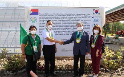 <p><strong>SMART GREENHOUSE</strong>. Agriculture Secretary William Dar and Republic of Korea Ministry of Agriculture and Food and Rural Affairs (MAFRA) Education Promotion and Information Services (EPIS) President Dr. Lee Jong Soon (second and third from left) lead the inauguration of the smart greenhouse and capability building project at the Western Visayas Agricultural Research Center in Barangay Buntatala, Jaro on Thursday (March 31, 2022). The PHP200 million project is a grant from the Republic of Korea aimed at enhancing the production competitiveness of small and mid-sized farmers. <em>(Photo courtesy of Alan Jay Jacalan/Department of Agriculture)</em></p>