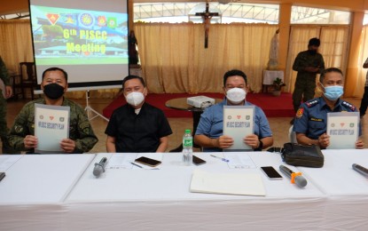 <p><strong>SECURITY PLAN</strong>. Officials of the Commission on Elections, the Philippine National Police, and the Armed Forces of the Philippines sign on Friday (April 1, 2022) a joint security plan for safe and peaceful elections in Negros Oriental on May 9. In the photo are (L-R) Brig. Gen. Leonardo Peña, commander of the 302nd Army Infantry Brigade, Msgr. Julius Heruela, convenor of the Diocese of Dumaguete, Comelec-Negros Oriental provincial election officer-designate lawyer Lionel Marco Castillano, and PNP provincial director Col. Germano Mallari. <em>(Photo by Judy Flores Partlow)</em></p>