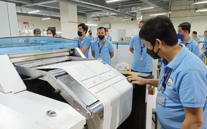 <p><strong>DONE.</strong> The last batch of the 67,442,616 official ballots for the May 9 polls is printed at the National Printing Office in Quezon City on Saturday (April 2, 2022). The Commission on Elections is way ahead of its April 25 target for completion. <em>(Photo courtesy of Comelec)</em></p>