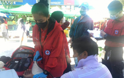 <p><strong>RED CROSS AT PENAGBENGA</strong>. Philippine Red Cross (PRC) emergency medical services personnel provide blood pressure monitoring, first aid, and ambulance service during the 2022 Panagbenga Festival: Session Road in Bloom on March 21-27, 2022. The PRC medical team served over 400 patients. <em>(Contributed photo)</em></p>
