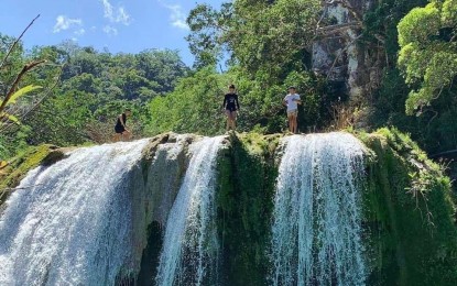 <p><strong>TANAP-AVIS FALLS.</strong> Tourists in this undated photo enjoy the waters of Ilocos Norte's Tanap-Avis Falls, the trails to which the local government plans to develop to help tourism in the area recover. The local government said it plans to spend PHP3 million for the development project. <em>(Photo courtesy of Tourism Ilocos Norte)</em></p>