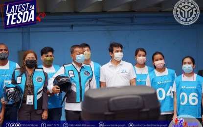 <p><strong>EMPOWERING RIDERS.</strong> Technical Education and Skills Development Authority Secretary Isidro Lapeña (fourth from left) and Angkas chief executive officer George Royeca (in white) lead the launching of the Basic Motorcycle Driving program on Wednesday (April 6, 2022) at the TESDA Complex in Bicutan, Taguig. The program aims to capacitate riders and professionalize motorcycle training in the country. <em>(Photo grabbed from TESDA's Facebook page)</em></p>