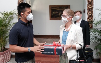 <p><strong>GERMAN ENVOY VISIT.</strong> Governor Matthew Joseph Manotoc gives a token to German ambassador to the Philippines Anke Reiffenstuel during her visit to Ilocos Norte on April 4, 2022. Manotoc said more jobs await Ilocano nurses wishing to work in Germany where there is high demand for healthcare workers to take care of its aging population. <em>(Photo courtesy of Matthew Marcos Manotoc FB page)</em></p>