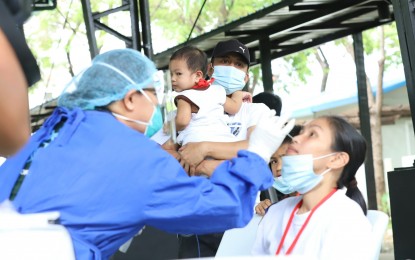 <p><strong>SWAB TEST.</strong> Balik Probinsya Bagong Pag-Asa program beneficiary couple, Michael Angelo Tel and Angeline Calibat undergo swab testing during the dispatch procedures at the BP2 Depot in Quezon City on Wednesday (April 6, 2022). Another four families consisting of nine individuals are scheduled to leave for Catanduanes and Sorsogon on Thursday. <em>(PNA photo by Robert Oswald P. Alfiler) </em></p>