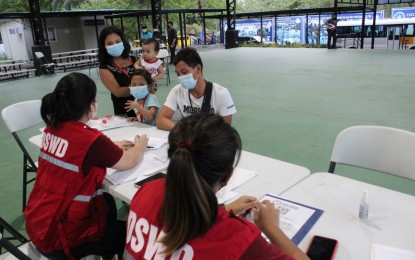 <p><strong>GOING HOME.</strong> Balik Probinsya, Bagong Pag-Asa program beneficiaries get instructions from social welfare officers at the BP2 depot in Diliman, Quezon City on Thursday night (April 7, 2022). Their batch returned home to Sorsogon and Albay provinces in the Bicol Region. <em>(PNA photo by Robert Oswald P. Alfiler)</em></p>