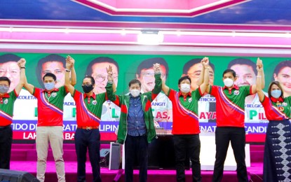 <p>President Rodrigo Duterte (center) with six of seven PDP-Laban senatorial bets (from left): Rodante Marcoleta, Robin Padilla, Salvador Panelo, Rey Langit, Greco Belgica, and Astra Pimentel<em> (Photo courtey of PDP-Laban Facebook)</em></p>
