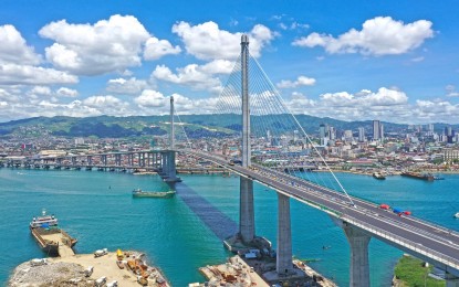 <p><strong>CEBU SKYLINE</strong>. Photo shows the almost-completed Cebu-Cordova Link Expressway with Cebu City's towering skyline in the background. Listed firm Cebu Landmasters Inc. has reported that the real estate industry continues to show signs of recovery from the pandemic. <em>(Photo courtesy of CCLEX)</em></p>