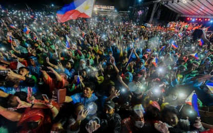 <p><strong>SOLID.</strong> Rain-soaked supporters cheer for presidential candidate Ferdinand Marcos Jr. during a rally at Leyte Sports Development Center in Tacloban City on Saturday night (April 9, 2022). Organizers estimated the crowd at 150,000. <em>(Photo courtesy of Mayor Alfred Romualdez)</em></p>