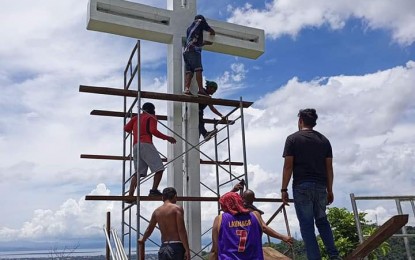 <p><strong>HOLY WEEK PREPS</strong>. Workers of the City General Services Office paint the 14th Station of the Cross at Abong-Abong Holy Hill as necessary preparations are being undertaken by the city government for the observance of the Holy Week. An estimated 20,000 Catholic devotees gather every Holy Week at Abong-Abong Holy Hill to pray at the 14 Station of the Cross at the foot of Mount Pulong Bato. <em>(Photo courtesy of City Hall Public Information Office)</em></p>