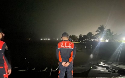 <p><strong>MONITORING.</strong> Balangiga, Eastern Samar firefighters conduct visibility and sea-level monitoring along coastal areas on Saturday night (April 9, 2022). Tropical Storm Agaton is moving slowly westward over the coastal waters of Balangiga as of the 2 p.m. weather bulletin Sunday. <em>(Photo courtesy of Balangiga Fire Station-Eastern Samar Facebook)</em></p>