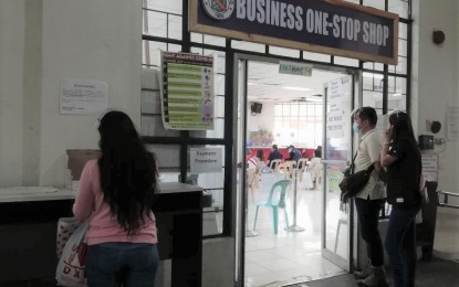 <p><strong>BIZ PERMIT.</strong> Business owners file their applications at a one-stop business center in Baguio City in this undated photo. The city government on Monday (April 11, 2022) said it has granted an amnesty to businesses not compliant with the National Building Code and the zoning ordinance due to circumstances beyond their control as a reprieve from the pandemic's effects. <em>(PNA file photo)</em></p>
