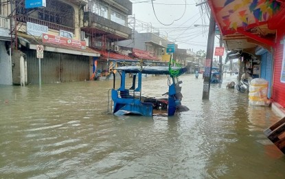 <p><strong>FLOODING.</strong> A flooded street in Baybay City, Leyte in this April 10, 2022 photo. Several local government units in Eastern Visayas have suspended work and classes on Monday as Tropical Depression Agaton dumped heavy rains in the region. <em>(Photo courtesy of Discover Baybay City)</em></p>
