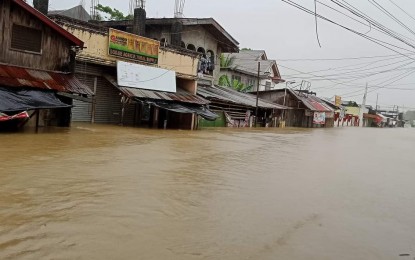 <p><strong>FLOODING</strong>. The public market of the town of Sigma is flooded as a result of heavy rains due to tropical depression Agaton on Tuesday (April 12, 2022). Cindy Ferrer, information officer of the Office of the Civil Defense (OCD) in Western Visayas, said the floods which hit Western Visayas have affected 12,989 families or 59,944 persons. <em>(Photo courtesy of PDRRMO Capiz FB page)</em></p>