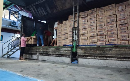 <p><strong>AID FOR VICTIMS</strong>. A truckload of family food packs for "Agaton" victims in Baybay City outside the Department of Social Welfare and Development (DSWD) warehouse in Palo, Leyte on Tuesday (April 12, 2022). The DSWD Eastern Visayas has released 5,113 family food packs as an initial assistance to victims of floodings and landslides. <em>(Photo courtesy of DSWD Region 8)</em></p>