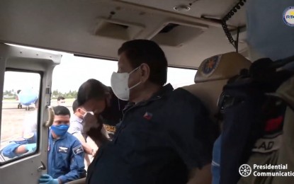 <p><strong>AERIAL INSPECTION.</strong> President Rodrigo Duterte conducts an aerial inspection of areas hit by Tropical Depression Agaton in Leyte province on Friday (April 15, 2022). The number of reported fatalities has reached 137. <em>(Screengrab from Radio Television Malacañang)</em></p>