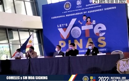 <p><strong>MOA SIGNING.</strong> The Commission on Elections and the SM Supermalls sign a memorandum of agreement at the Music Hall of SM Mall of Asia in Pasay City on Monday (April 18, 2022). The deal aims to help the voters experience how to use the vote counting machines in the upcoming May 9 polls. <em>(Screengrab from Comelec FB page).</em></p>