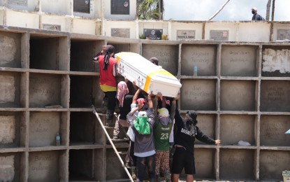 <p><strong>CASUALTY.</strong> One of the landslide victims laid to rest at the Immaculada Conception Memorial Gardens in Baybay City on Sunday (April 17, 2022). The landslide death toll in Baybay City and Abuyog in Leyte has climbed to 170 while 176 remained missing as of April 17 as responders continue retrieval operations one week after the tragedy. <em>(Photo courtesy of Baybay City information office)</em></p>