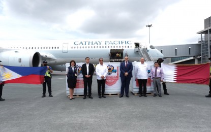 <p><strong>MORE JABS.</strong> Officials led by National Task Force Against Covid-19 chief Secretary Carlito Galvez Jr. (3rd from left) receive the donation of 75,000 doses of Sinovac vaccines at Ninoy Aquino International Airport Terminal 3 on April 13, 2022. Fifty thousand doses were from the Qatar government and 25,000 were from the manufacturer itself. <em>(Photo courtesy of NTF)</em></p>