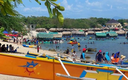 <p><strong>LA MILAGROSA COVE</strong>. Visitors enjoy the beach at the La Milagrosa Cove in Badoc, Ilocos Norte in this undated photo. Every summer, the spot is one of the most frequently visited sites in Ilocos Norte as boats for hire are also available when visitors want to experience freediving on Badoc Island, which is just a few minutes' ride from the cove in calm weather. <em>(Ilocos Norte Tourism photo)</em></p>