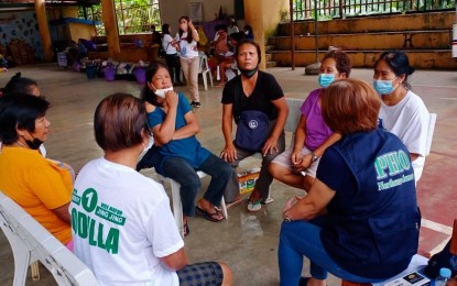 <p><strong>DEALING WITH ANXIETIES</strong>. A member of the mental health and psychosocial support services response team from Northern Samar counseling landslide survivors in Baybay City. The Northern Samar provincial government has sent a team to landslide-hit towns in Leyte on Tuesday(April 19, 2022) to provide psychosocial services to survivors.<em> (Photo courtesy of Northern Samar provincial government)</em></p>