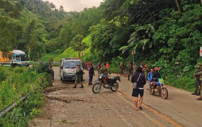 <p><strong>POST-BLAST SCENE.</strong> Police and soldiers secure portions of the North Upi and South Upi highway in Maguindanao after two roadside bombs successively went off at past 5 p.m. Tuesday (April 19, 2022). A supporter of a provincial board member was slightly injured in the incident.<em> (Photo courtesy of the office of Maguindanao Gov. Mariam Mangudadatu)</em></p>