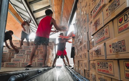 <p><strong>MORE AID</strong>. Volunteers unload family food packs shipped by the Department of Social Welfare and Development (DSWD) for landslide victims in Eastern Visayas. The DSWD regional office received on Thursday (April 21, 2022) 5,000 family food packs, 1,000 sleeping kits, 2,900 kitchen kits, and 3,500 hygiene kits. <em>(Photo courtesy of DSWD Eastern Visayas)</em></p>