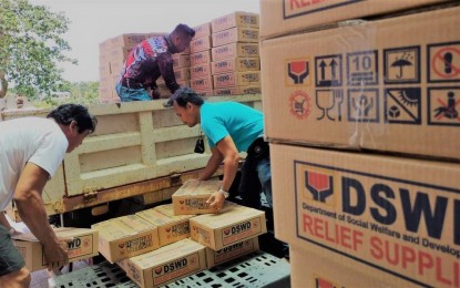 <p><strong>AFTER THE STORM</strong>. Volunteers load family food packs from the national government for victims of Tropical Storm Agaton in Inopacan, Leyte in this April 19, 2022 photo. The Commission on Elections reminded candidates to seek an exemption if they want to distribute aid to victims of calamities. <em>(Photo courtesy of DSWD Eastern Visayas)</em></p>