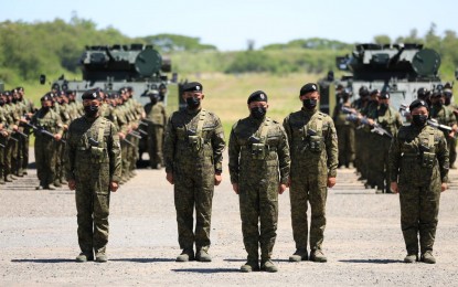 <p><strong>REACTIVATION.</strong> The Philippine Army's Armor Division officers and enlisted personnel stand in formation during the reactivation of the 1st Tank Battalion and the deactivation of the 8th Cavalry Company at the division’s headquarters at Camp O'Donnell in Capas, Tarlac on Thursday (April 21, 2022). The 1st Tank Battalion traces its roots to the organization of the 1st Cavalry Regiment under the PA’s 1st Infantry Division in 1935. <em>(Photo courtesy of the Philippine Army)</em></p>
