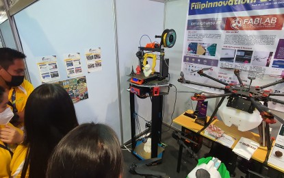 <p><strong>3D FUTURE.</strong> Guests inspect several 3D printers and other mechanical innovations such as the drone seeder during the opening of  Innovation Day Thursday (April 21, 2022) in Cagayan de Oro City. The Innovation Day is organized by the government and the private sector under the Regional Research Development and Innovation Committee in Northern Mindanao. <em>(PNA photo by Nef Luczon)</em></p>