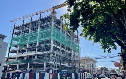 <p><strong>MEN AT WORK</strong>. Construction work in full swing at the Dap-ayan Center, one of the "Big 3" infrastructure projects of the Ilocos Norte government, in Laoag City in this undated photo. The completion of these projects by December 2022 aims to boost Ilocos Norte's economic recovery due to the global pandemic. <em>(Photo by Leilanie G. Adriano)</em></p>