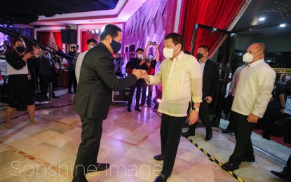 <p><strong>SPECIAL GUEST.</strong> President Rodrigo Roa Duterte attends the 72nd birthday of Kingdom of Jesus Christ founder Pastor Apollo Quiboloy at the KJC headquarters in Davao City on Monday night (April 25, 2022). Quiboloy is the President’s spiritual adviser. <em>(Courtesy of Sonshine Image)</em></p>