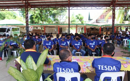 <p><strong>TRAINEES.</strong> Scholars of the Technical Education and Skills Development Authority (TESDA) in Sipalay City, Negros Occidental with officials during their completion ceremony held at Mambaroto covered court on April 22, 2022. Some 175 trainees obtained technical and vocations qualifications under the agency’s Training for Work Scholarship Program. <em>(Photo courtesy of TESDA-Negros Occidental)</em></p>