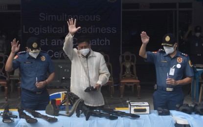 <p><strong>BLESSING</strong>. Pastor Joellan Turibio (center) leads the blessing of equipment that will be used by personnel of Bacolod City Police Office during the May 9 national and local elections. The activity, conducted in the presence of Col. Thomas Joseph Martir (left), city director, and Lt. David Cachumbo Jr. (right), deputy city director for operations, was held at the BCPO grounds on Wednesday (April 27, 2022). <em>(Photo courtesy of Bacolod City Police Office)</em></p>