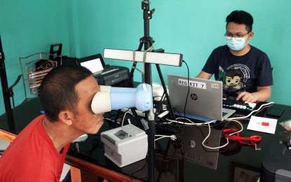 <p><strong>PHILSYS REGISTRATION</strong>. A registrant undergoes an iris scan as part of the second stage of his registration for the Philippine Identification System in this undated photo in Baguio City. The Philippine Statistics Authority (PSA) in the Cordillera said that almost 600,000 out of the 1.2 million target population in the region have completed the registration process. <em>(PNA file photo by PNA)</em></p>