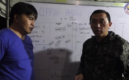 <p><strong>BRIDGE TRAGEDY</strong>. Bohol Governor Arthur Yap (right) and Loay Mayor Hilario Ayuban discuss the collapse of the Loay Bridge on Wednesday (April 27, 2022) that claimed the lives of four people and injured 20 others. Yap said he ordered a fast reconstruction of the bridge and an investigation of the tragic incident.<em> (Screengrab from Bohol PIO video)</em></p>