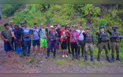 <p><strong>NPA SURRENDERERS.</strong> Nine former New People’s Army (NPA) communist rebels pose with soldiers who convinced them to surrender in Lebak, Sultan Kudarat, on Thursday (April 28, 2022). The Army’s 37th Infantry Battalion says the rebels surrendered due to hunger and exhaustion. <em>(Photo courtesy of 37IB)</em></p>