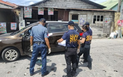 <p><strong>INVESTIGATION</strong>. A team from the Scene of the Crime Operation (SOCO) investigates the killing of a village chief in the City of San Fernando, Pampanga. Alvin Mendoza, chairperson of Barangay Alasas and was running as a city councilor, was driving his vehicle when shot by still unidentified suspects riding in tandem on board a motorcycle in Barangay Magliman, City of San Fernando on Saturday morning (April 30, 2022).<em> (Photo by PRO-3)</em></p>