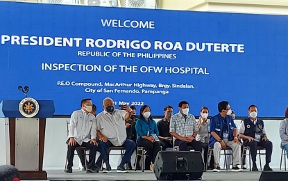 <p><strong>LAUNCH.</strong> President Rodrigo Duterte (4th from left) leads the inspection of the OFW Hospital in the City of San Fernando, Pampanga on Sunday (May 1, 2022). He dedicated the facility to the country's "modern heroes". <em>(PTV Facebook photo)</em></p>