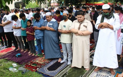 <p><strong>EID PRAYERS.</strong> Muslims say their prayers with friends and family as they celebrate Eid al-Fitr, the festival ending the holy month of Ramadan, on Monday (May 2, 2022) morning at the Ecoland Mosque (Jamjom Masjid) in Davao City. This year's celebration of Eid al-Fitr is a time to promote social healing and reconciliation as the country prepares to usher in its next batch of leaders, Defense Secretary Delfin Lorenzana said. <em>(PNA photo by Robinson Niñal Jr.)</em></p>
