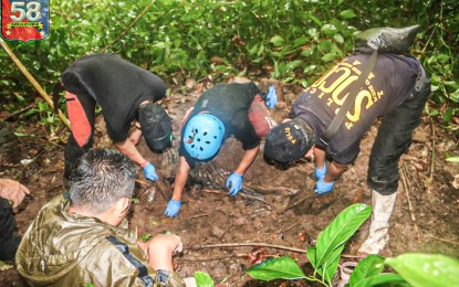<p><strong>COMBATANT'S REMAINS.</strong> Soldiers from the Army’s 58th Infantry Battalion, together with the police’s Scene of the Crime Operatives and village officials, recover the skeletal remains of a communist New People’s Army rebel in Barangay Mimbuntong, Gingoog City, Misamis Oriental, Monday (May 2, 2022). A former NPA guerrilla revealed the location of the shallow grave. <em>(Photo courtesy of 58IB)</em><br /><br /></p>