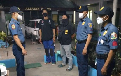 <div><strong>INSPECTION</strong>. Lt. Virgilio Pagaduan Jr., chief of police of Meycauayan City Police Station, inspects the deployed personnel in different polling precincts on Wednesday night (May 4, 2022). The move was to ensure the security of vote counting machines and other election paraphernalia. <em>(Photo courtesy of Maycauayan City PNP) </em></div>