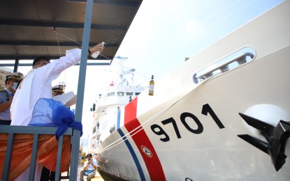 <p><strong>CHRISTENING</strong>. A bottle of wine is about to be broken on the hull of the MRRV-9701 as part of its commissioning as "BRP Teresa Magbanua" by the Philippine Coast Guard (PCG) on Friday (May 6, 2022). The vessel, the first of two such vessels procured from Japan, is considered the largest in the PCG fleet and is seen to boost the uniformed service's maritime capabilities. <em>(Photo courtesy of PCG)</em></p>