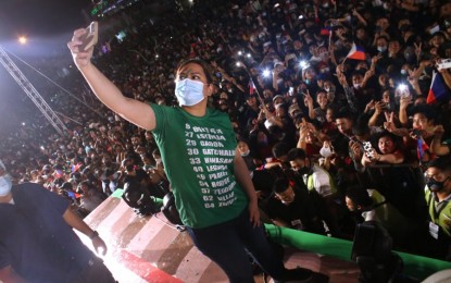 <p><strong>SELFIE WITH SUPPORTERS.</strong> UniTeam's vice presidential candidate Davao City Mayor Sara Z. Duterte takes a photo with supporters during the Miting de Avance in Tagum City, Davao del Norte on Thursday evening (May 5, 2022). In her speech, Duterte touted her various accomplishments as Davao City's chief executive.<em> (PNA photo by Robinson Niñal Jr.)</em></p>