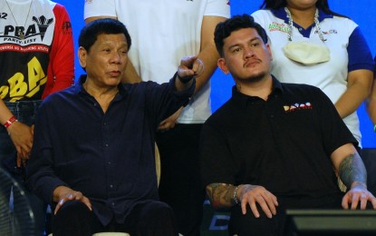 <p><strong>FUTURE.</strong> President Rodrigo Duterte (left) shows up in Davao City on Friday (May 6, 2022) to support the miting de avance of his youngest son, Acting Mayor Sebastian Duterte, who is eyeing to succeed sister Sara. The President advised his son to maintain peace and order in the city by fighting illegal drugs. <em>(PNA photo by Robinson Niñal)</em></p>