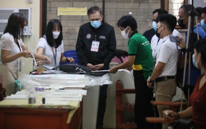 <p><strong>OFFICIAL WITNESS.</strong> Commission on Elections Chairperson Saidamen Pangarungan (center) observes the start of voting at Andres Bonifacio Elementary School along Gil Puyat Avenue, Pasay City on Monday (May 9, 2022). The poll body said complaints about the electoral process should be filed before the proper forum. <em>(PNA photo by Avito Dalan)</em></p>