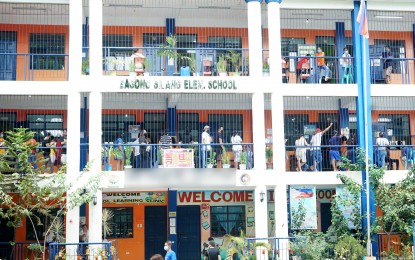 <p>Registered voters wait their turn to enter polling precincts at Bagong Silang Elementary School in Caloocan City on May 9, 2022. (PNA file photo by Ben Briones)</p>