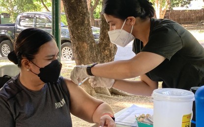 <p><strong>VAX DRIVE</strong>. Army nurse administers booster dose on a personnel during the Covid-19 vaccination drive at Fort Bonifacio, Taguig, Metro Manila on Tuesday (May 10, 2022). A booster shot is given as an added protection against Covid-19. <em>(Photo courtesy of PA)</em> </p>